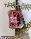 “Quibbler” Enamel Pin