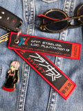 The "Strelizia" Franxx Flight Tag Keychain is a 5-inch by 1-inch double-sided woven keychain designed for fans of the popular anime series "Darling in the Franxx." This vibrant keychain features a keyring and a lobster clasp for easy attachment to keys, bags, or other personal items. It combines practicality with a stylish nod to the anime, making it a must-have accessory for any enthusiast.